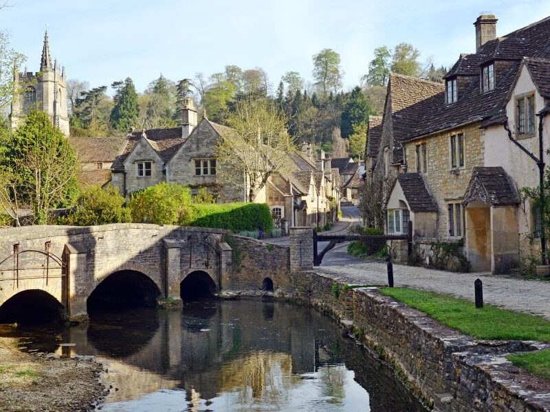 This is an image of a small street full of cute, quaint houses in the Cotswolds.
