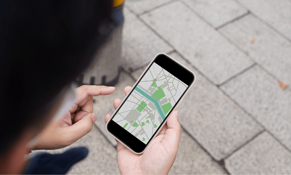 Important things to know London: This is an image of someone looking at a map on their phone navigating around town.