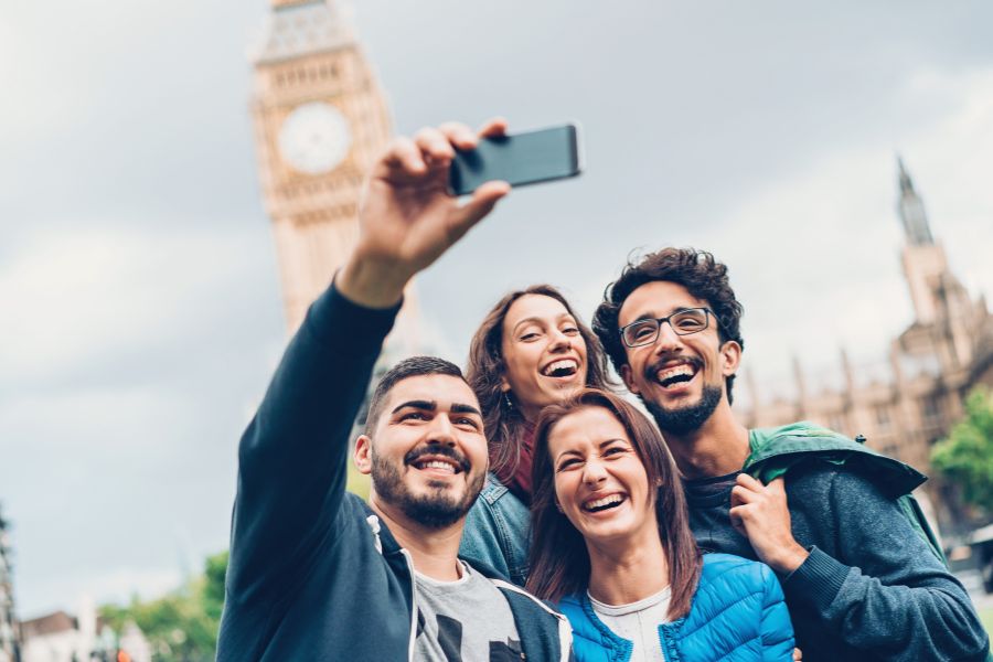 A group of friends taking a selfie in central London