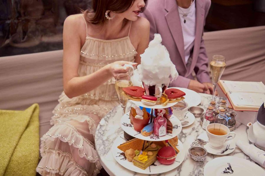 An assorted collection of cakes, sandwiches and tea in this unique afternoon Tea. This is one of the must try dishes in London