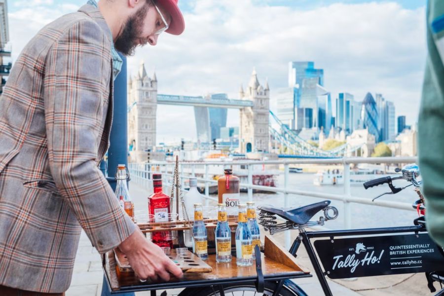 Gin and tonic tasting cart set up on a London bike tour with Tower Bridge in the background