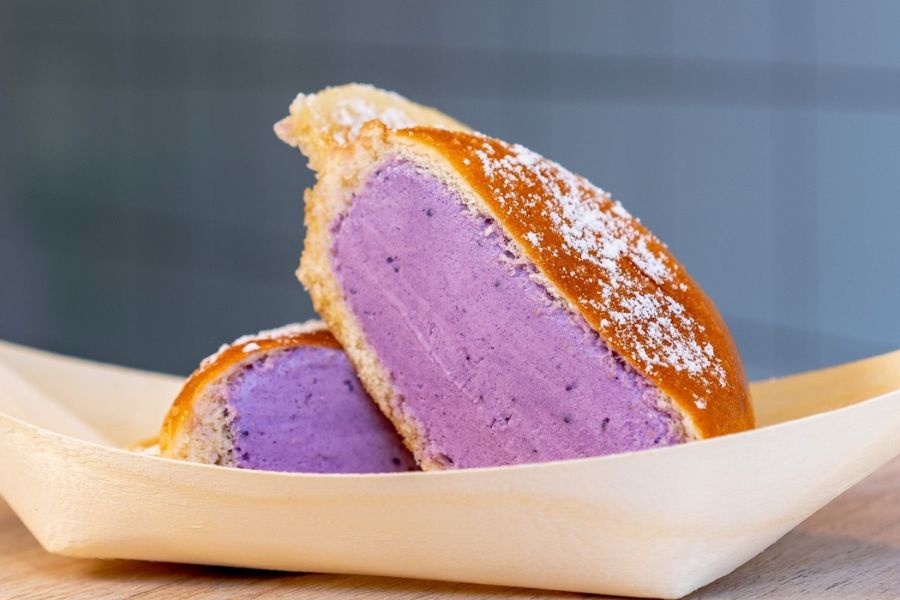 This is an image of a donut with ube cream inside.