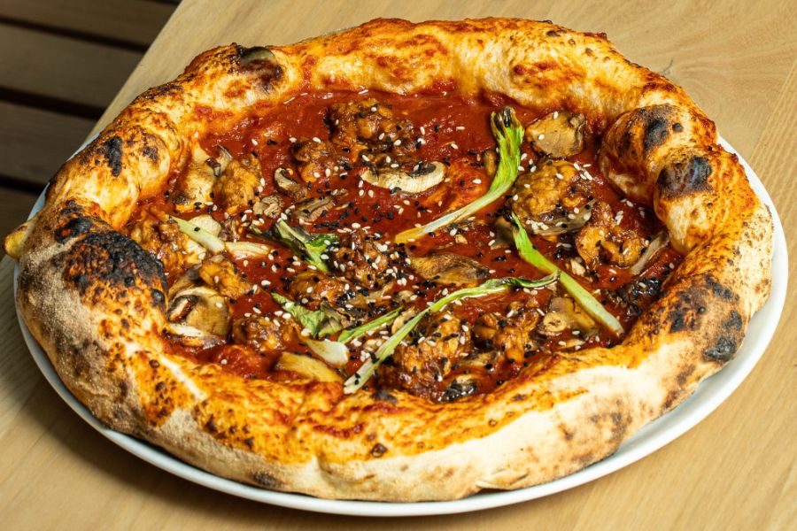 This is an image of a pizza with spicy toppings.