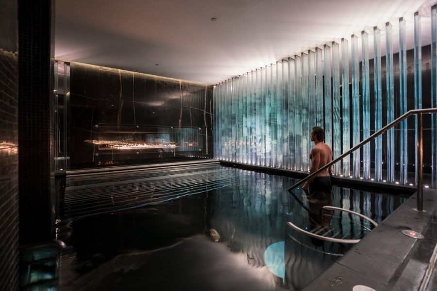 A visitor in the pool for their spa treatment at the Corinthia Hotel in London