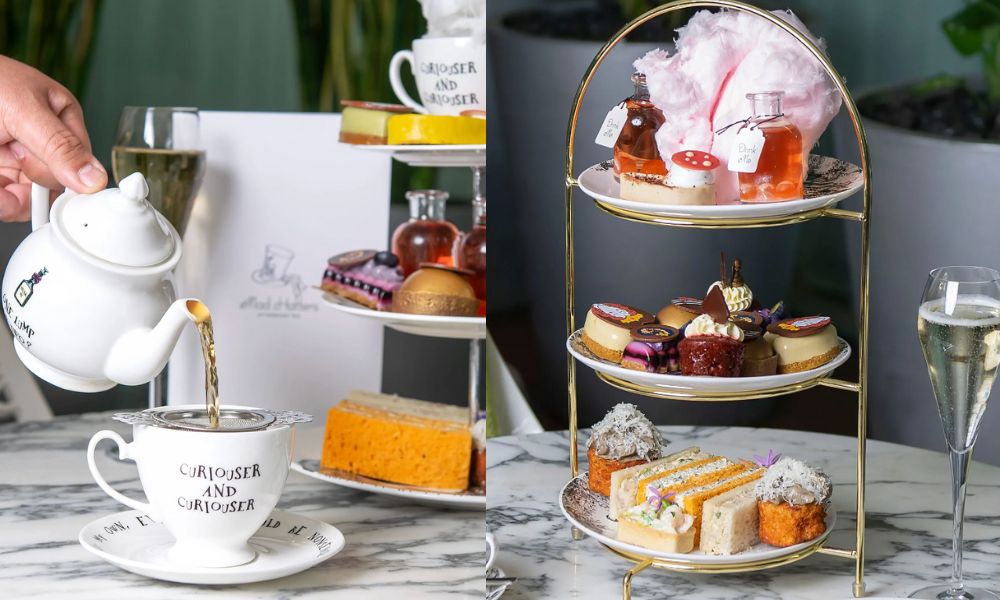 This is an image of someone pouring tea from a teapot into a teacup. To the right, there is also a tiered stand full of treats and cakes.