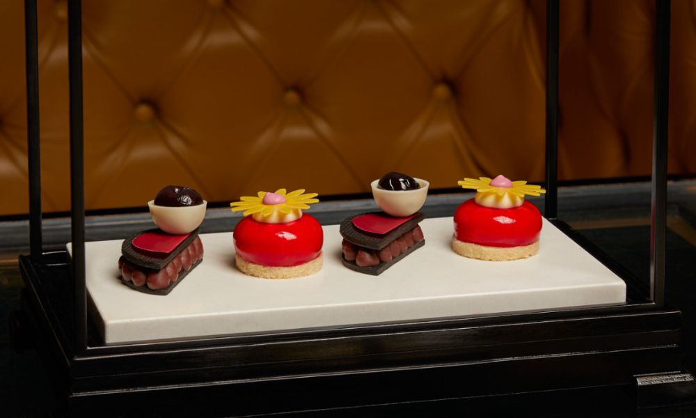This is an image of intricately-designed cakes on a platter.