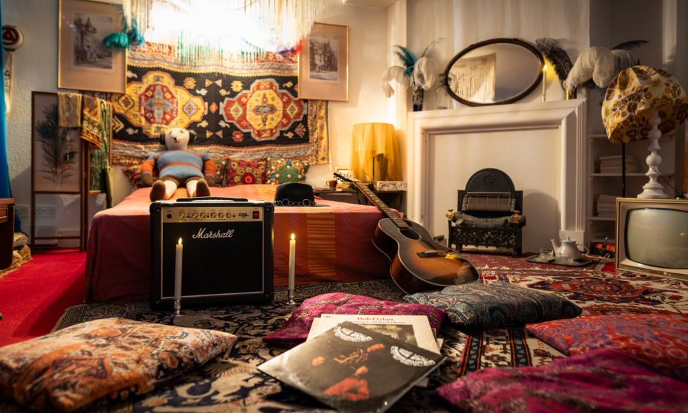 This is an image of the Handel & Hendrix Museum with plenty of bedding, memorabilia, musical instruments and more scattered around.