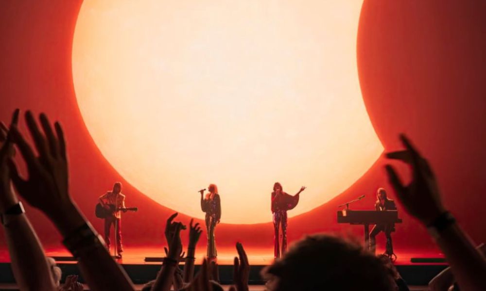 Best West End shows in London: This is an image of holograms of ABBA performing on stage in front of a crowd.
