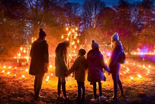 Family enjoying their time watching the Christmas Lighting at the Kew Gardens