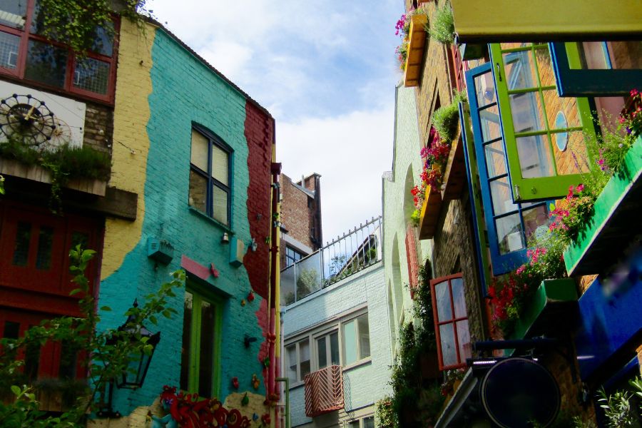 This is an image of Neal's Yard aka a beautiful courtyard of colourful buildings.