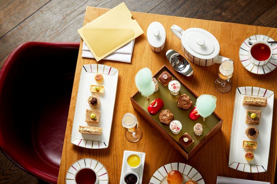 This is an image of a table full of high tea foods.