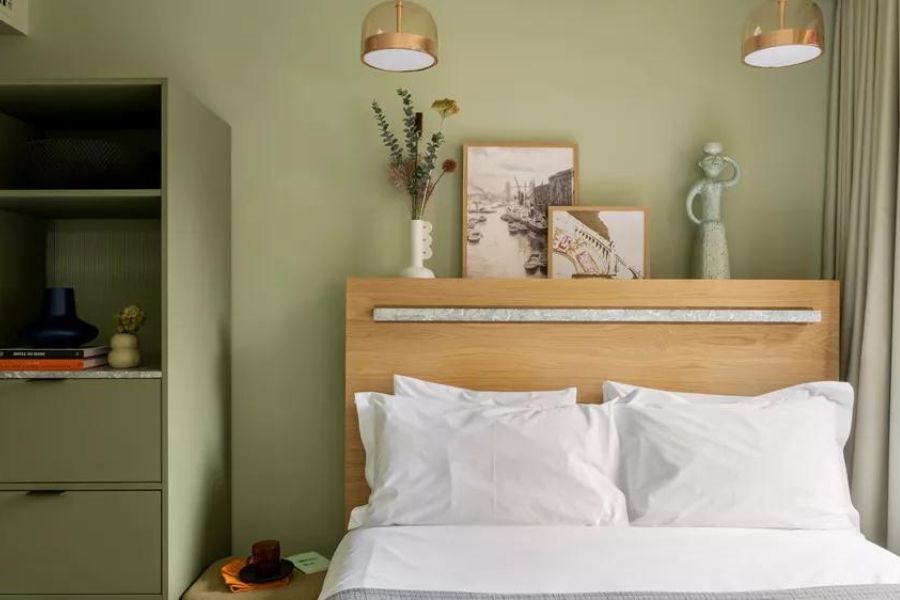 Studio room at Lock at the Broken Wharf, painted in sage colour. This apart-hotel is one of the top eco-friendly hotels in London
