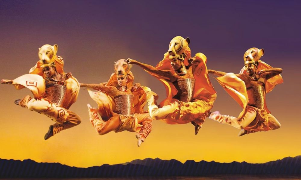 This is an image of people dressed in lion suits for the Lion King show.