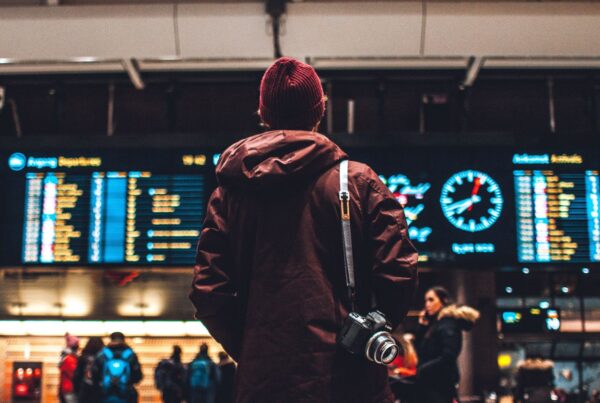 A passenger checking for train timings while travelling from a London airport to the city center