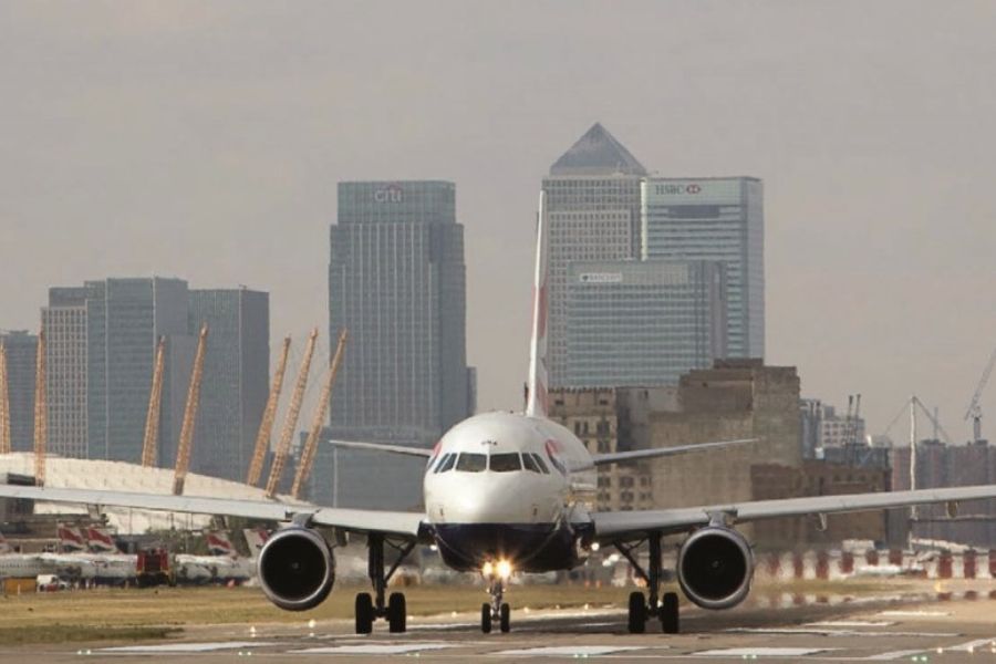 An airplane arriving at London City airport before the passengers are able to commute from this London airport to the city center