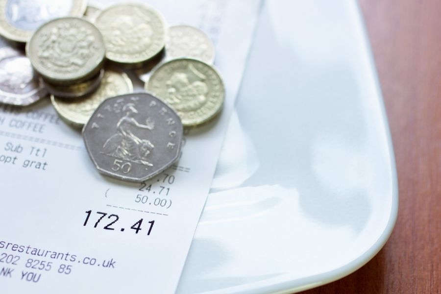 Coins are kept as a tip by the customer along with the bill. Tipping etiquette is one of the mistakes Americans make when visiting London