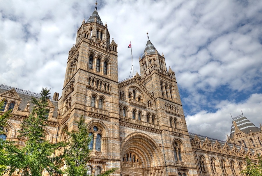 Outside view of the Natural History Museum with two main towers and archway entrance