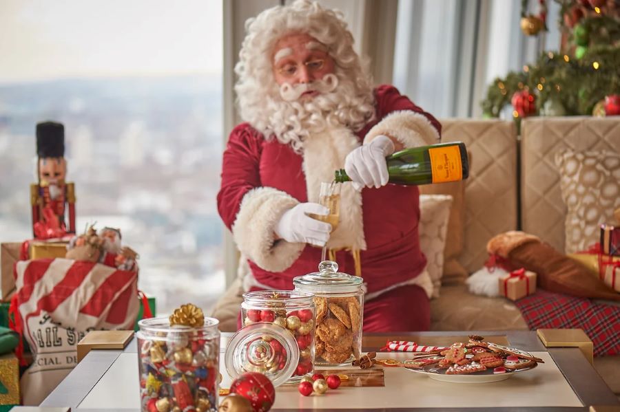 Waiter dressed up at Santa Claus for the festivities at the Shard; don't miss out on the Festive Skyline Afternoon Tea at Ting as it is one of the top things to do in london during the christmas season