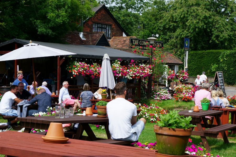 People enjoying their drinks outdoor on a sunny day is one of the best things about pubs in London