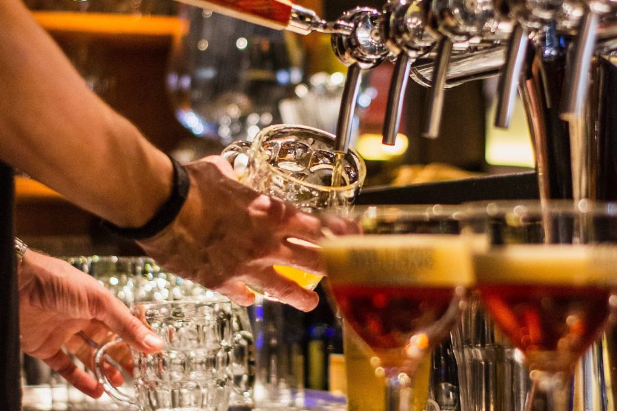 Bartend poring a pint of beer can be witnessed in all the pubs in London