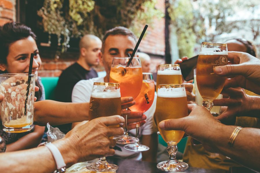Saying cheers before you drink is a must to do while drinking with your friends in pubs in London