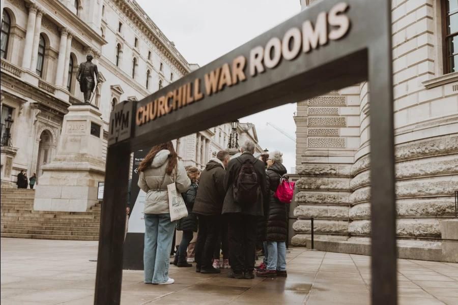 A group of people on a tour at the Churchill War Rooms in London