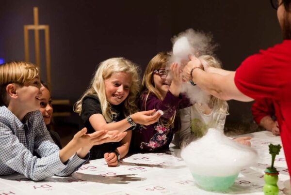 Children having fun doing a science experiments during one of the top London kid-friendly tours