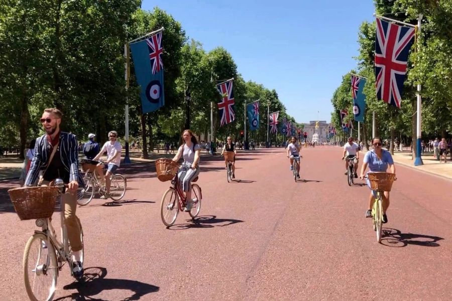 People enjoying a bike ride on a sunny day during one of the top kid-friendly London Tours