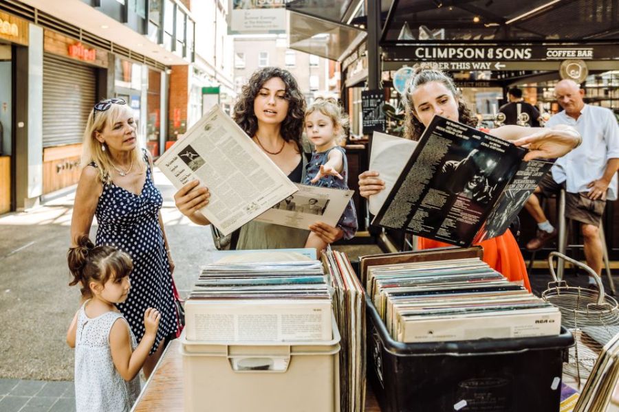 Visitors checking out vinyl records in Shoreditch during one of the top private tours of London