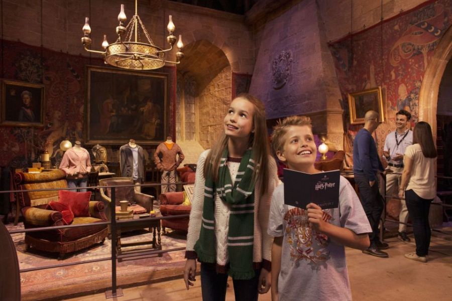 Children enjoying the Gryffindor common room set. This is one of the things to do in London for Harry Potter fans
