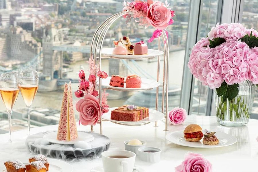 Ting's Pink Afternoon tea spread overlooking the Tower Bridge in the background