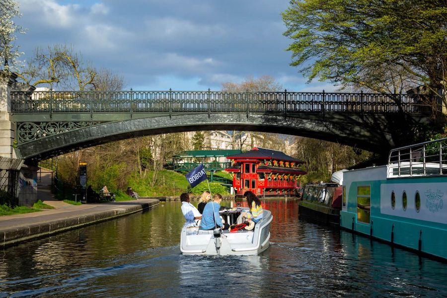 Friends enjoying their ride along the Regents Canal in a GoBoat in London during July.