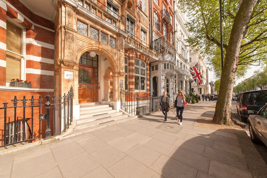Amazing historic London building with an arched entrance for Astor Hostel in Hyde Park.