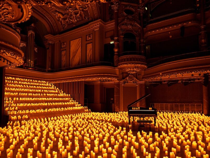 A candlelit music all with a piano at the centre for one of the candlelight concerts in London