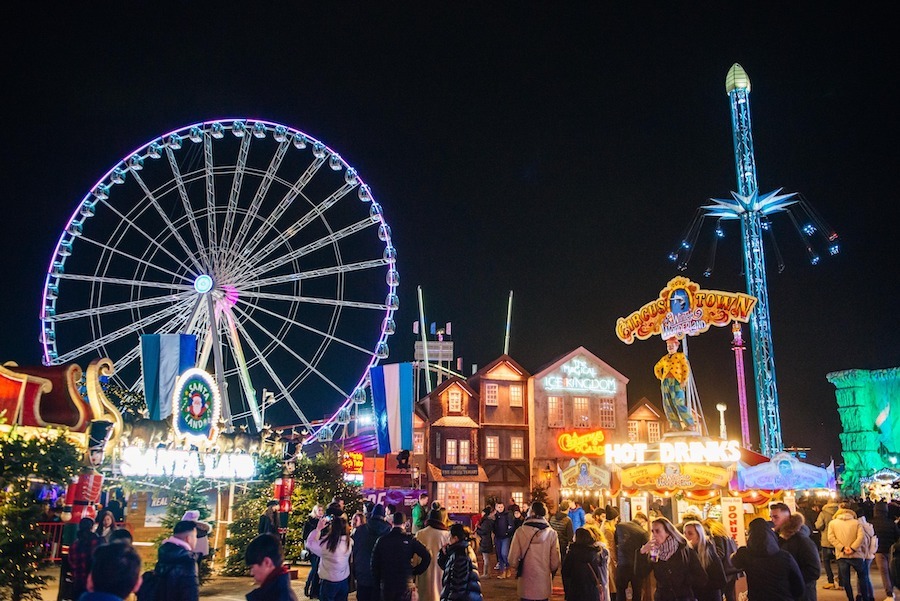 The fun-fair at Winter Wonderland welcoming visitors in the evening. Visiting this market is one of the top things to do in london during the christmas season