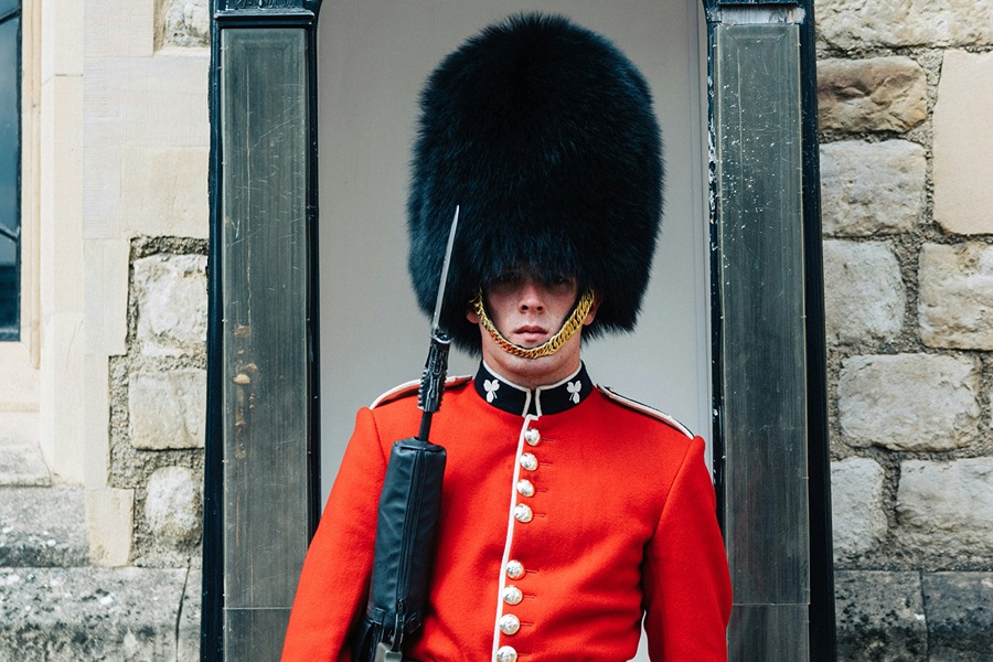 Ceremonial guard in red uniform during the Changing of the Guard, one of the London attractions included with the Explorer Pass.