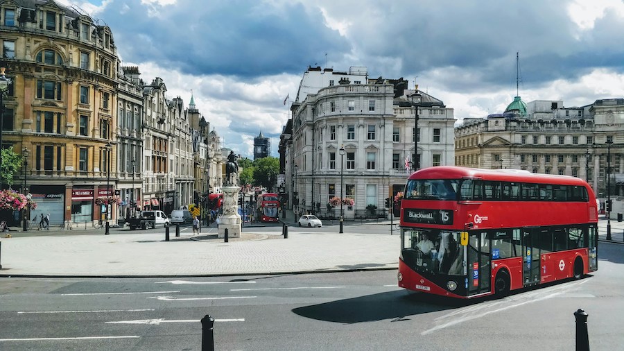 This is an image of a double-decker bus navigating through central London.