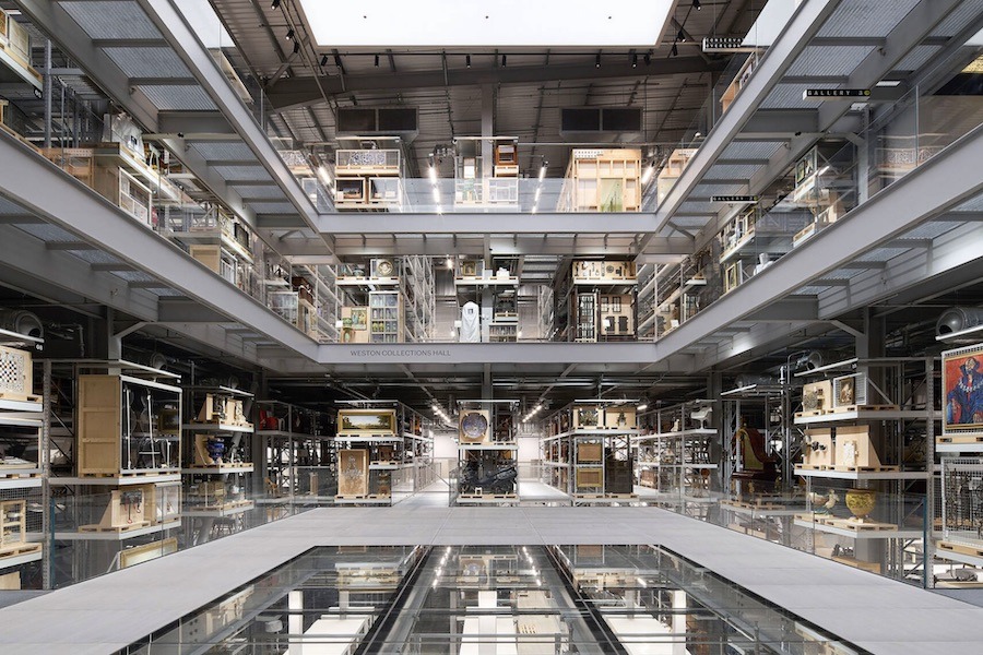 This is an image of a big warehouse full of archive museum artifacts. Each level has a glass flooring to make it look very modern and minimalistic.